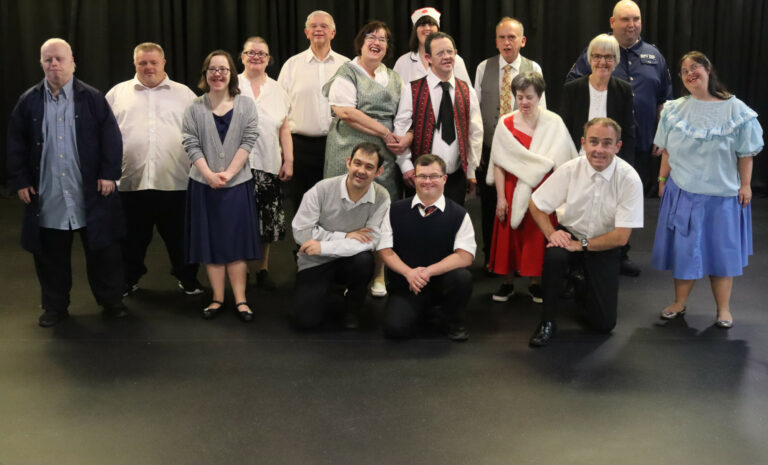 Members of New Centre Stage, posing during a theatre production.