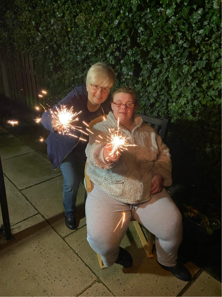 2 women holding sparklers at Poplars