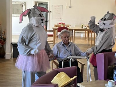 Care worker in bunny costume for easter celebration
