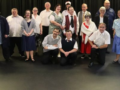 Members of New Centre Stage, posing during a theatre production.