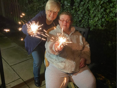 2 women holding sparklers at Poplars